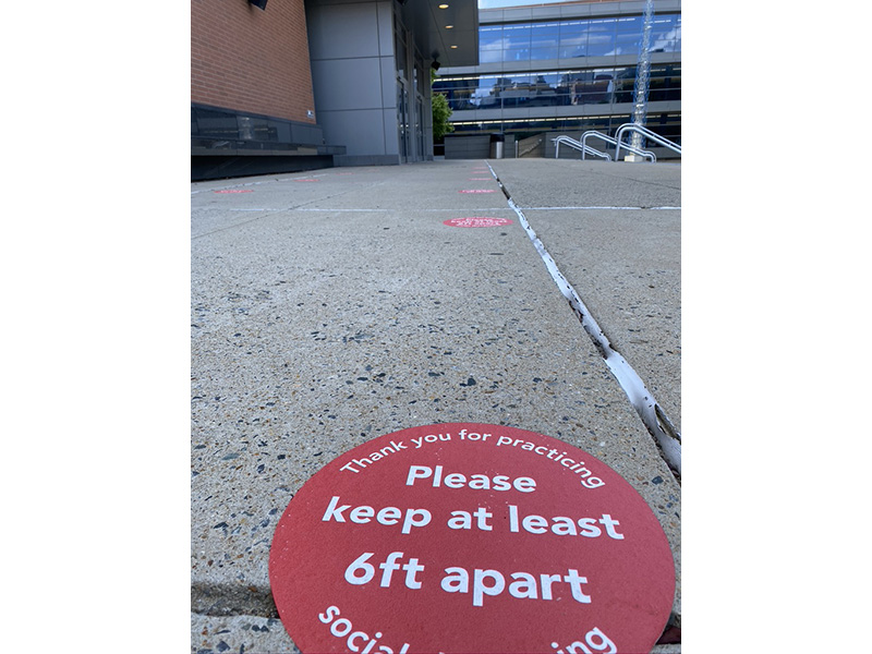 Social distancing signs and markers throughout the courthouse 